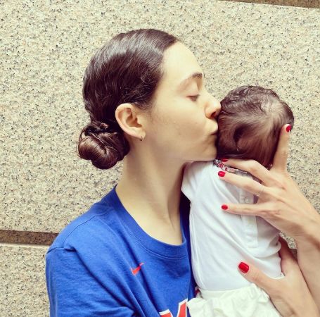 Emmy Rossum shares a photo with her daughter for the first time.